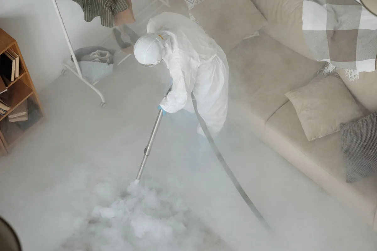 Biohazard cleanup technician in protective equipment, Morrice, MI